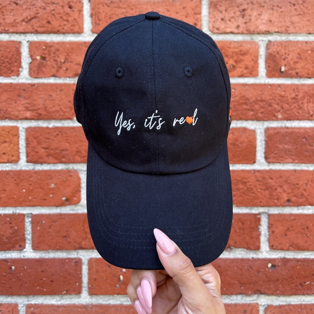 “Yes it’s real” 🍑 dad hat in black